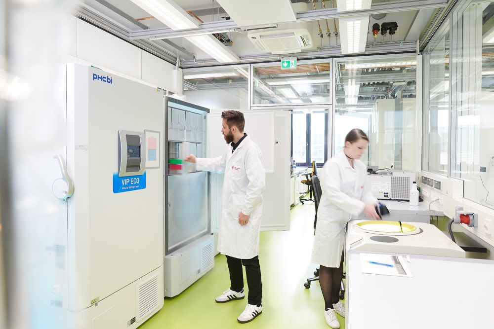 Laboratory in goettingen: cold storage room with two people working.