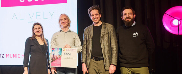 Four people on stage at ELSA Pitch Bowl 2025 – winner Endurivac receives Audience Award certificate worth €500.