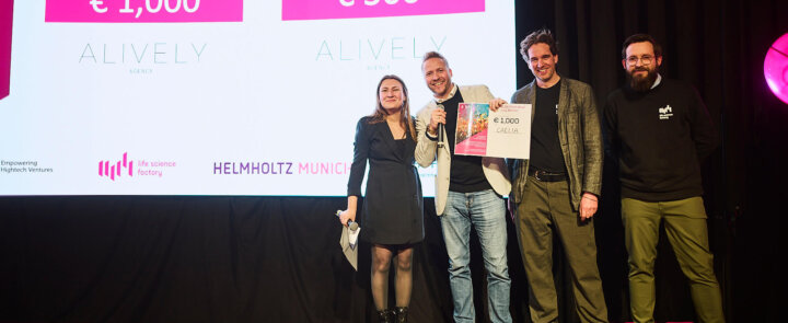 Four people on stage at ELSA Pitch Bowl 2025 - winner Caelia Health receives award certificate worth €1,000.