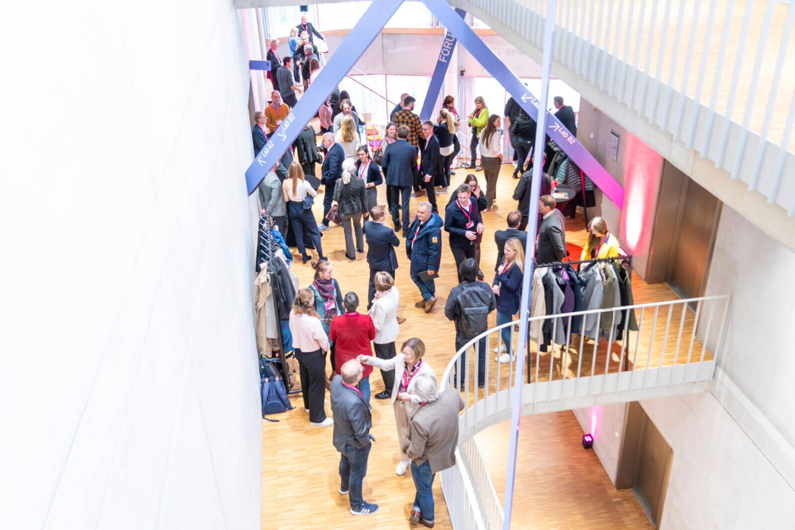 An event with numerous guests in the Life Science Factory Munich, view from above.